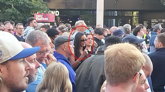 Maya Jama in a crowd of people.