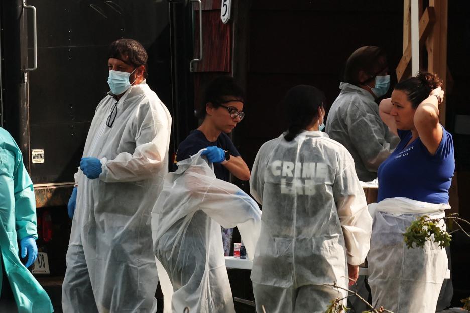Crime scene investigators at a residence.