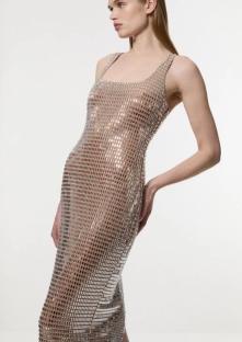 Woman wearing a sequined midi dress.