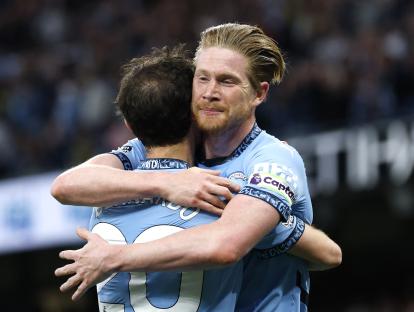 Kevin De Bruyne and Bernardo Silva celebrating a goal.
