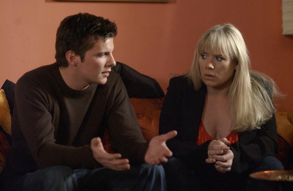 Nigel Harman as Dennis Rickman confronting Letitia Dean as Sharon Watts, who looks concerned.