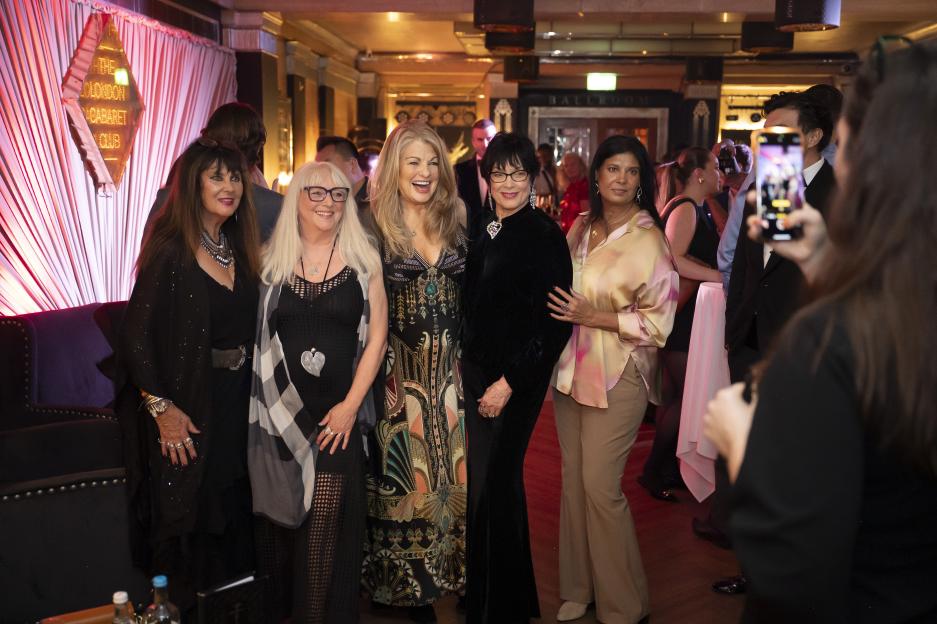 Martine Beswick, Caroline Munro, Carole Ashby, and Safira Afzal with 007GB member at the London Cabaret Club.