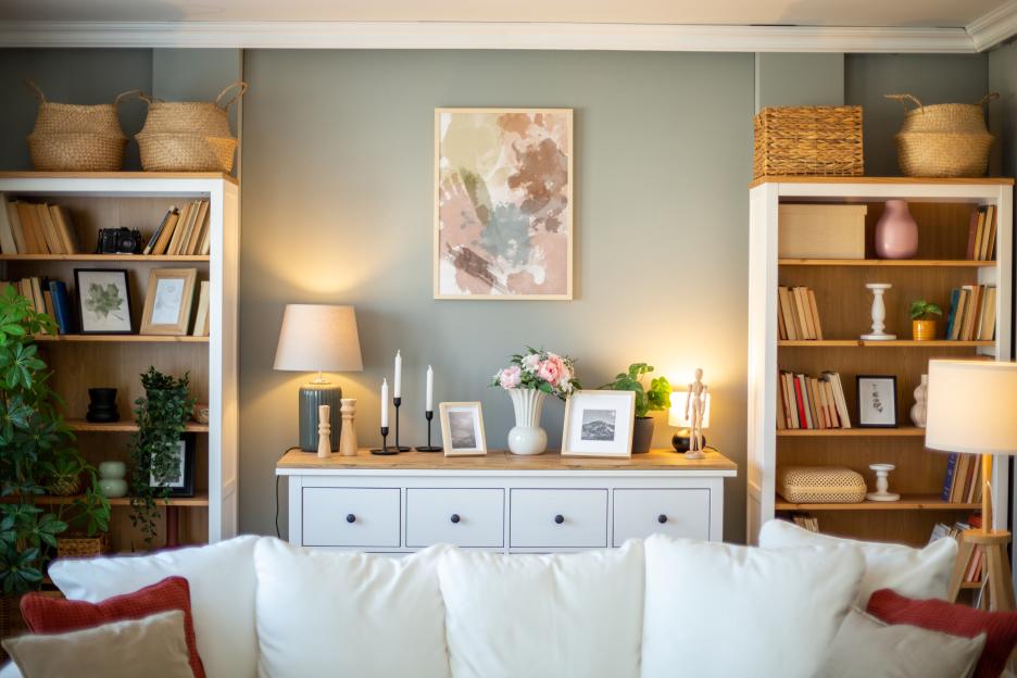 Cozy living room with bookshelves and a white sofa.