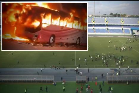Footie clash abandoned as ‘fans storm pitch and burn team bus with live ammunition fired’