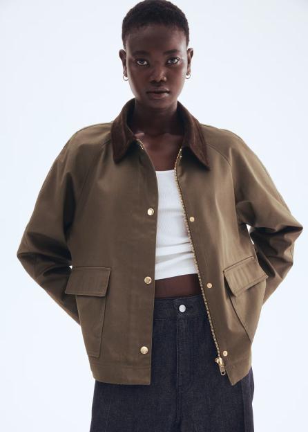 Model wearing olive green jacket.