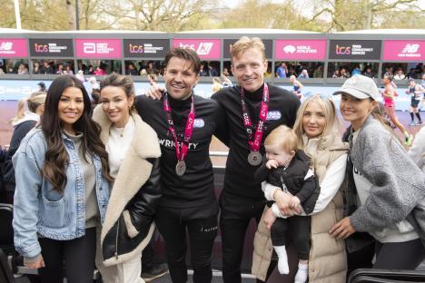Group photo of Mark Wright, Josh Wright, Jess Wright, Michelle Keegan, Holly Kane Wright, and Natalya Wright after completing the London Marathon.