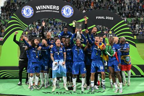Chelsea players celebrating on a soccer field.