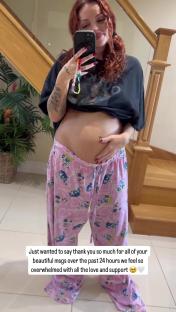 Pregnant woman showing her baby bump.