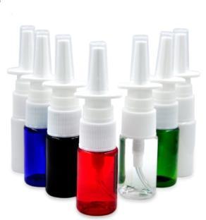 Several small spray bottles in various colors.