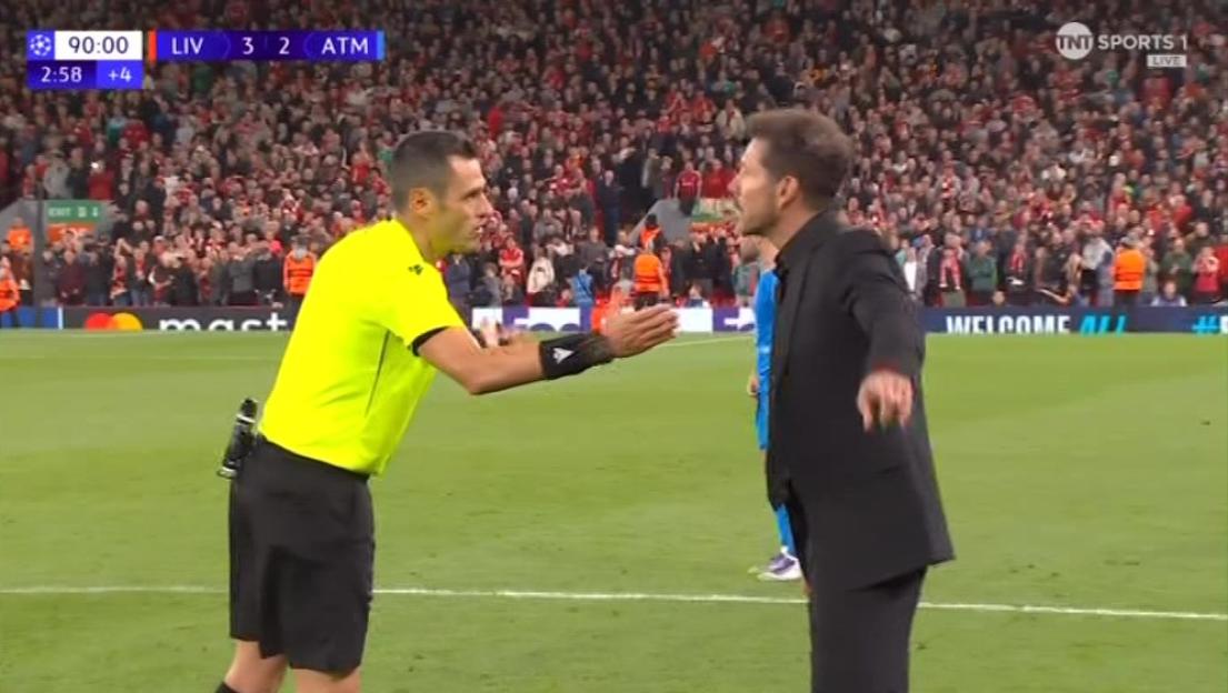 Diego Simeone arguing with the referee during a Liverpool match.