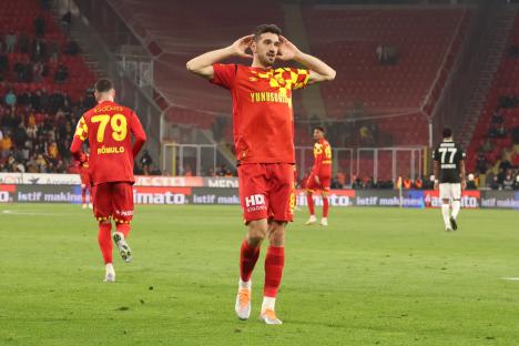 Soccer player Kubilay Kanatsizkus celebrating a goal.
