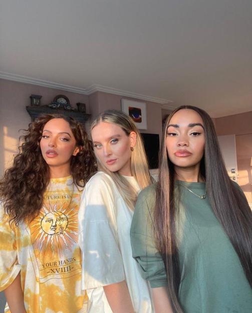Jade Thirlwall, Perrie Edwards, and Leigh-Anne Pinnock of Little Mix posing together.