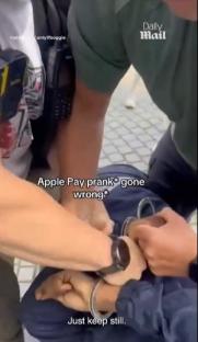 Person being handcuffed after an Apple Pay prank goes wrong.