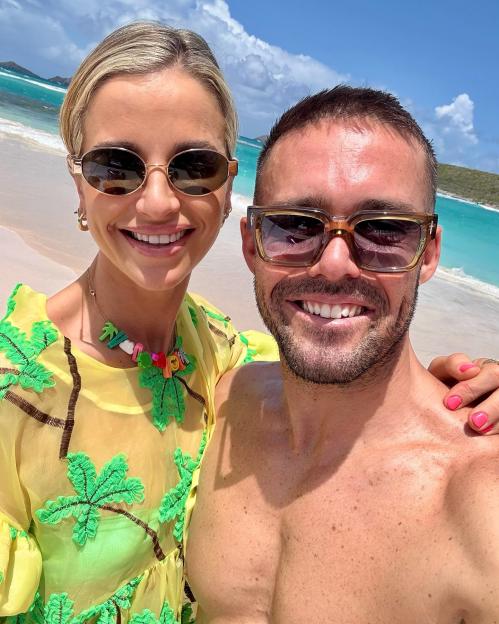 Spencer Matthews and Vogue Williams on a beach.