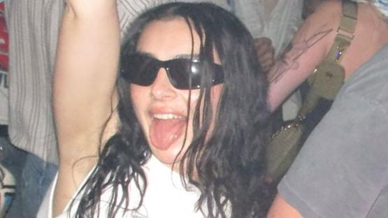 Charli XCX throws jab at rival Coachella act with ‘savage’ message on sash at wild desert after-party
