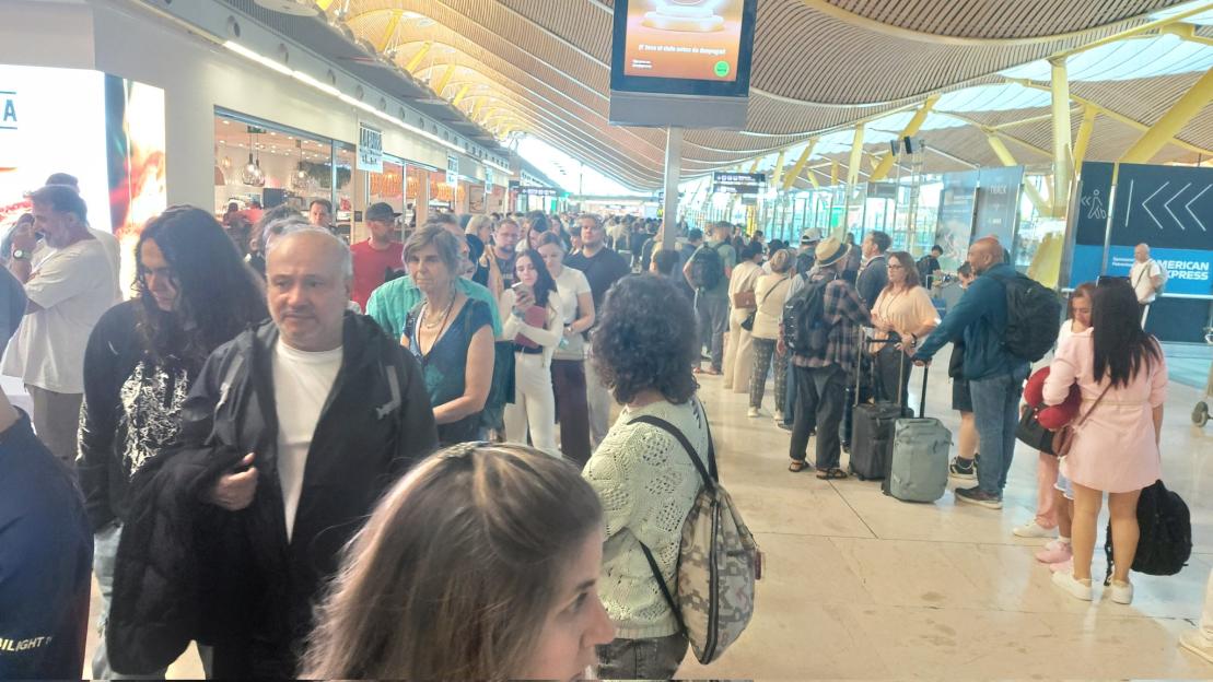 Long lines of people at an airport.