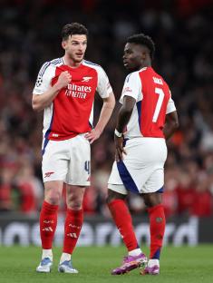 Declan Rice and Bukayo Saka of Arsenal on the field.