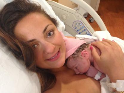 Mother holding newborn baby.