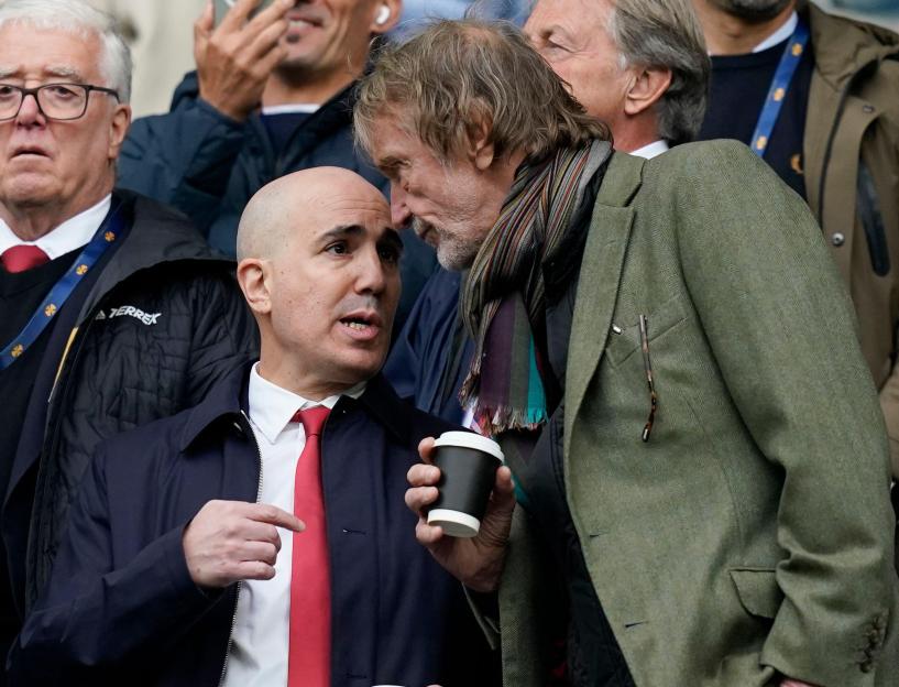 Omar Berrada and Sir Jim Ratcliffe in conversation at a Manchester United match.