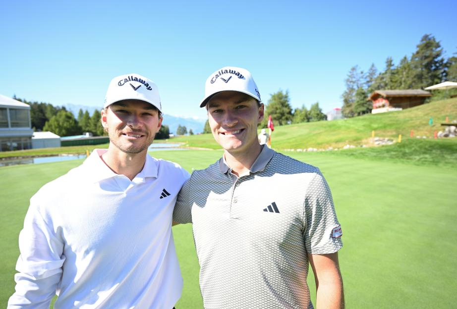 Rasmus Højgaard and Nicolai Hojgaard posing together on a golf course.