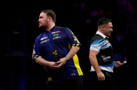 Luke Littler and Gerwyn Price at a darts match.