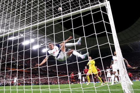 Micky van de Ven of Tottenham Hotspur clearing a ball from the goal line.