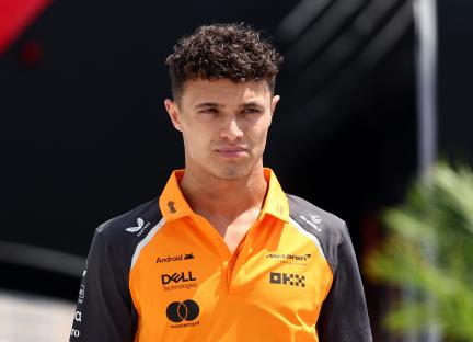 Lando Norris in McLaren Formula 1 team polo shirt.