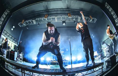 I Prevail performing live on stage.