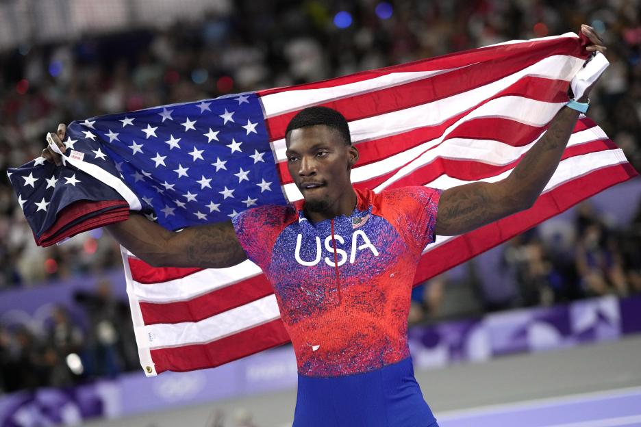 Fred Kerley celebrating after his third-place finish in the men's 100-meter final at the 2024 Summer Olympics.