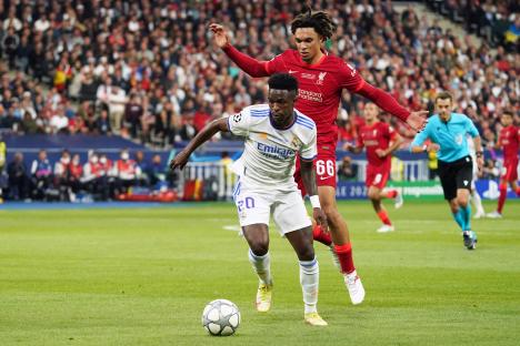 Vinicius Junior of Real Madrid dribbling the ball during a soccer match.