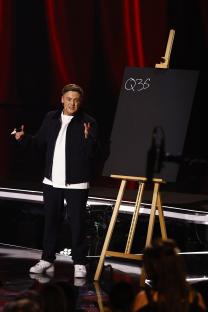 Harry Moulding on Britain's Got Talent, holding a marker and standing in front of an easel with 