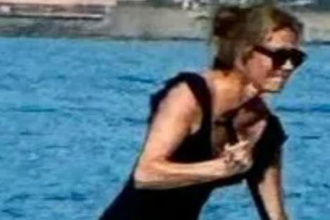 Cat Deeley looks incredible as she strips down to a black swimsuit on family holiday with rarely-seen kids