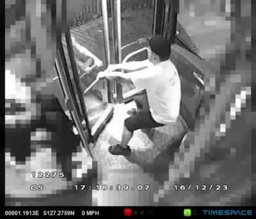 Security camera footage of a man exiting a bus.