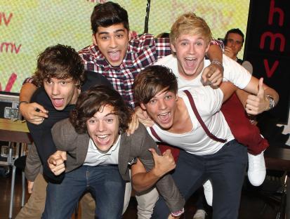 One Direction band members at a launch event.