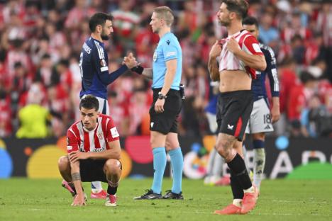 Benat Prados of Athletic Bilbao dejected on the soccer pitch.