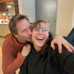 Chesney Hawkes kissing his daughter on the cheek.