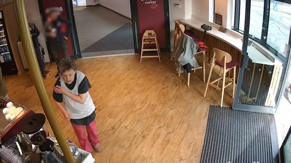 CCTV footage of Helen Eade inside a coffee shop.