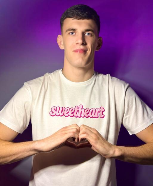 Cameron Barnes modeling a T-shirt