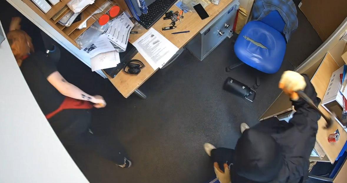 CCTV image of a robbery in progress.