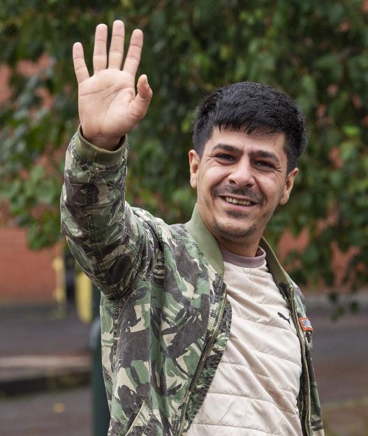 Mr. Ardi Hussein Saleh Rahim waving.