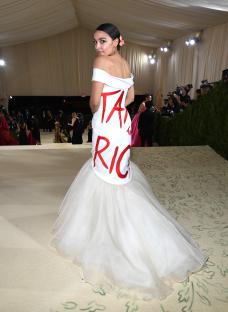 Alexandria Ocasio-Cortez at the Met Gala in a white gown with