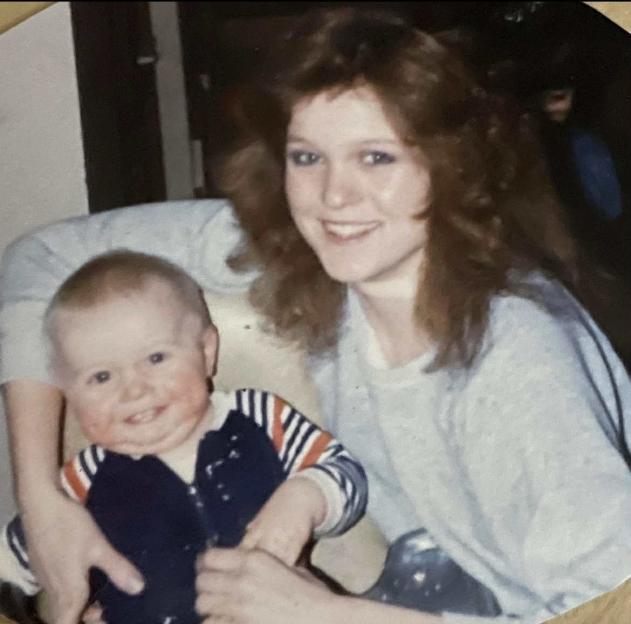 Raylee Reinhart holding her baby, Benjamin Wilcock.