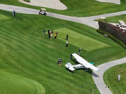 Private plane making an emergency landing on a golf course.