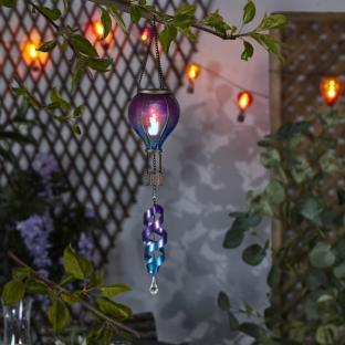 Solar-powered hot air balloon light with spiral accent.