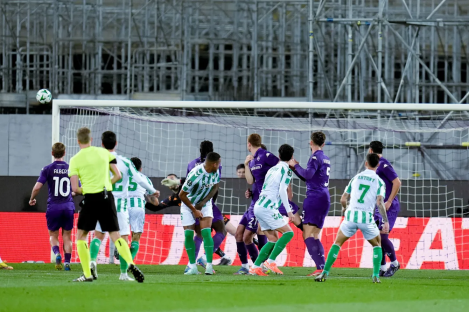 Soccer players vying for a goal.