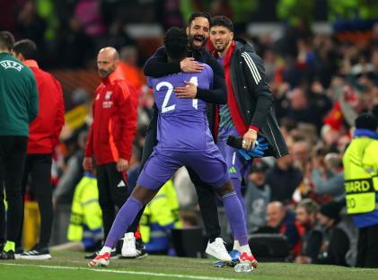 Andre Onana of Manchester United celebrates with a teammate.