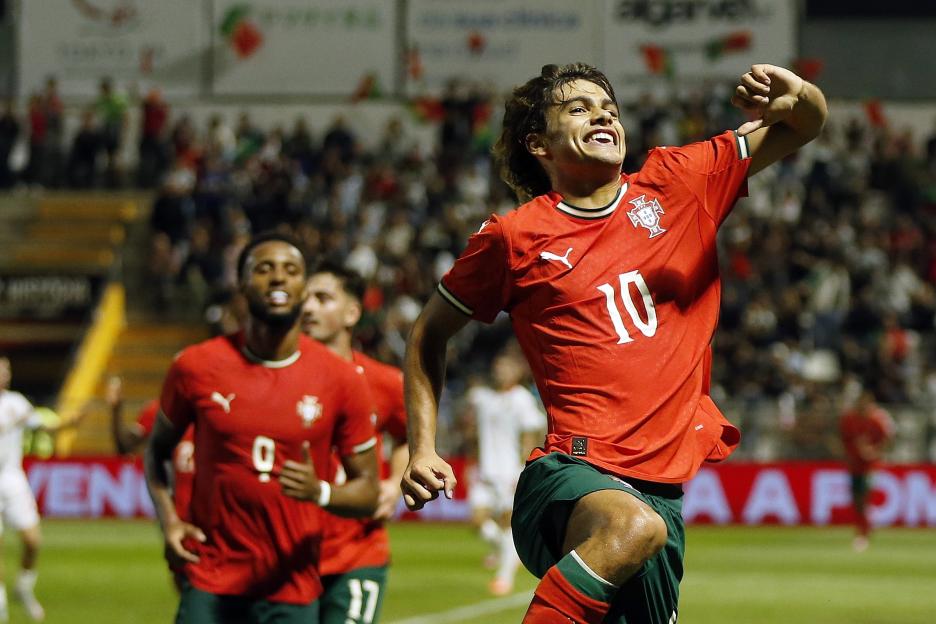 Portugal's Rodrigo Mora celebrates scoring a goal during a soccer match.