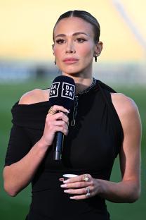 Diletta Leotta, DAZN presenter, holding a microphone.