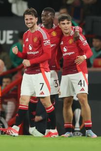 Manchester United players celebrating a goal.