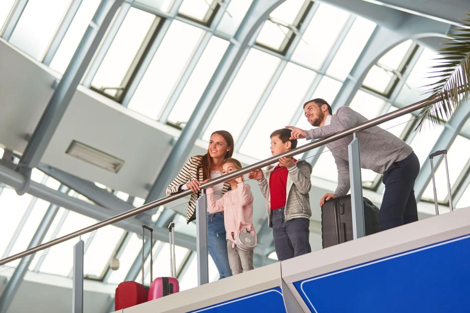 Family with two children at the airport.